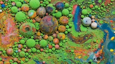 Color inks react to form a beautiful structure of paint bubbles Stock Footage 121223472