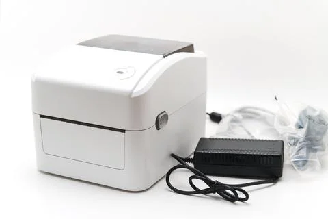 Color label printer with power supply and cables for office use Stock Photos