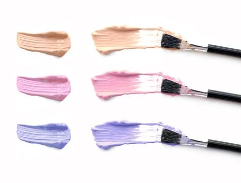 Color make up liquid set with make-up brush on white Stock Photos