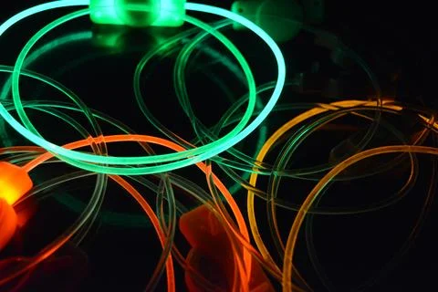 Color motion blurred magic neon red, blue, green, yellow light circles, lines. Stock Illustration