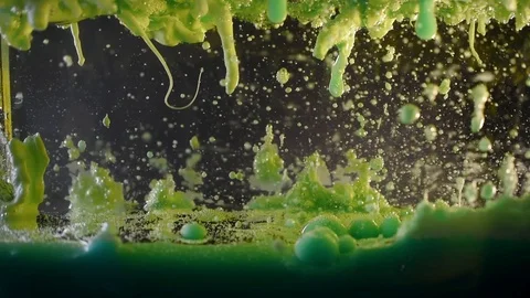 Color oil stream stirring up alien landscape creating orbs and shifting Stock Footage 107301136