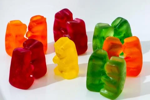 Color pairs of gummy bears and one lonely bear Stock Photos