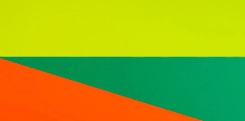Color papers geometry composition background with bright yellow, orange and.. Stock Photos