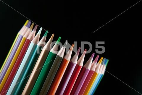 Color pencils on black background Stock Photos