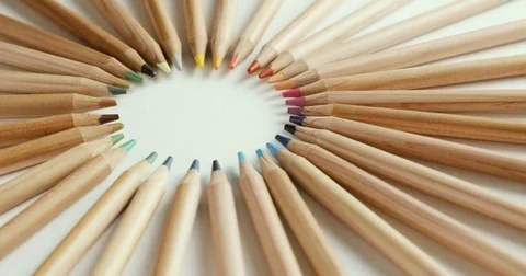 Color pencils forming a circle while turning on themselves on a white background Stock Footage 79170167