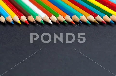 Color pencils isolated on black background close up Stock Photos