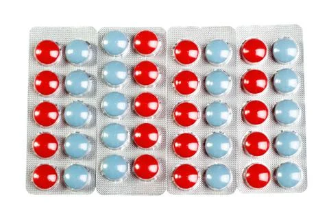 Color pills in a blister pack on white Stock Photos