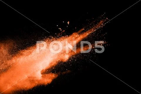Color powder explosion on black background. Stock Photos