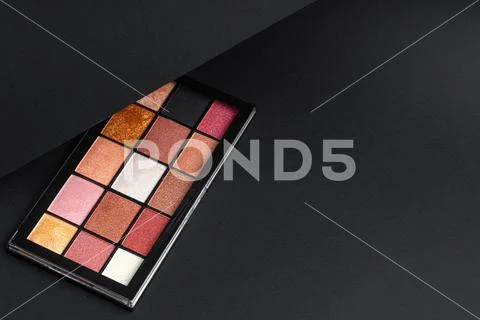 Color professional cosmetic palette on a dark background Stock Photos