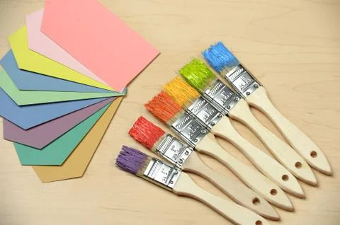 Color Samples and Paintbrushes Stock Photos