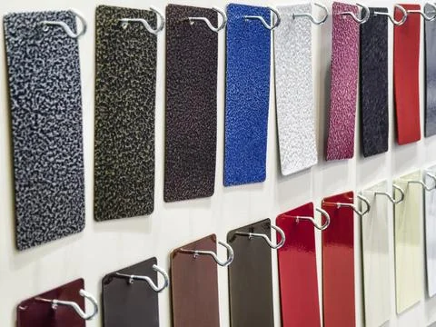 Color samples are displayed on a board at a design studio during a material.. Stock Photos