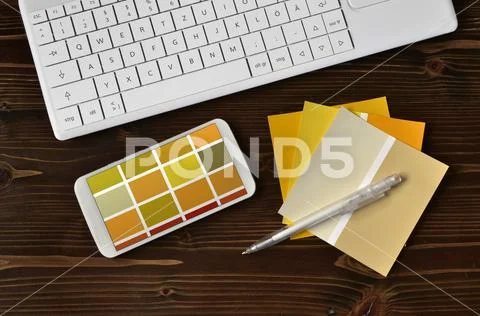 Color samples cmyk on black keyboard mobile Stock Photos