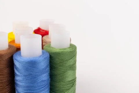 Color sewing threads isolated on white background. Different colors.Bright bo Stock Photos