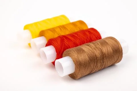 Color sewing threads isolated on white background. Different colors.Bright bo Stock Photos