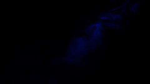 Color smoke slowly floating through space against black background. Stock Footage 122924974