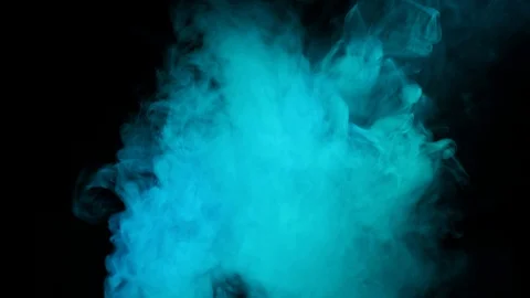 Color smoke slowly floating through space against black background. Stock Footage 125931246