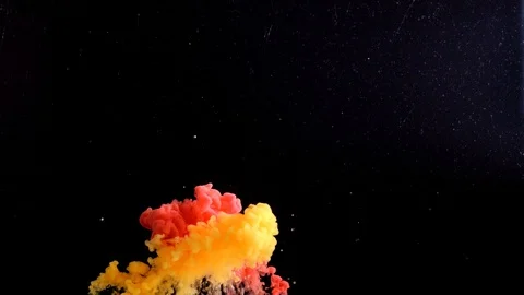 Color splashes of ink isolated on black background. Abstract paint in water Stock Footage 111389016