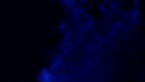 Color splashes of ink isolated on black background. Abstract paint in water Stock Footage 111389596