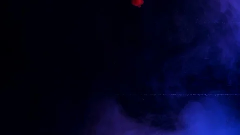 Color splashes of ink isolated on black background. Abstract paint in water Stock Footage 111389680