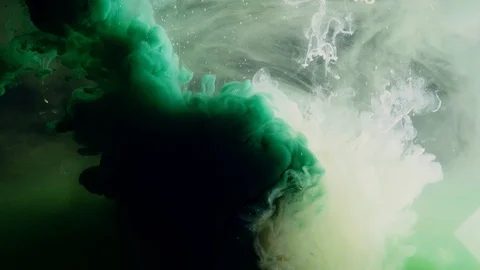 Color splashes of ink isolated on black background. Abstract paint in water Stock Footage 111393880