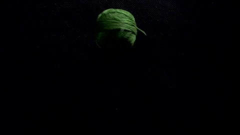 Color thread fall and roll on black background static slow motion Stock Footage 267982383