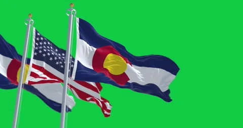 Colorado and the US flags waving isolated on a green background Stock Footage 244465379