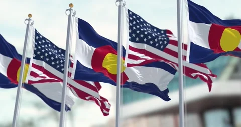 Colorado and US flags waving in the wind on a clear day Stock-Footage 258673219