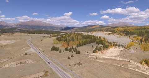 Colorado autumn - road to the mountains (pull back) Stock Footage