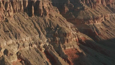 The Colorado River flows between the vertical cliffs of the Grand Canyon. Stock Footage 336577487