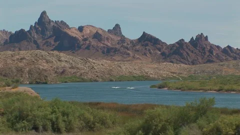 Colorado River with two speeding jet skies  in Needles, California USA Stock Footage 103290104