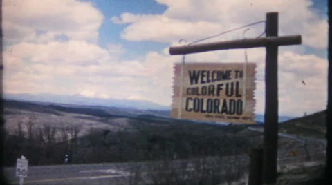 Colorado state line roadside highway marker 1950s vintage film home movie 1904 Stock Footage