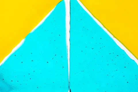 Colored absractical background based on aquamarine and yellow triangles Foto stock