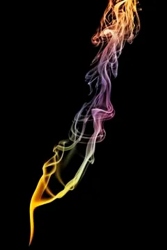 Colored abstract smoke isolated on black background. Stock Photos