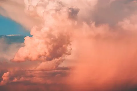 Colored air clouds in the sunset sky Stock Photos