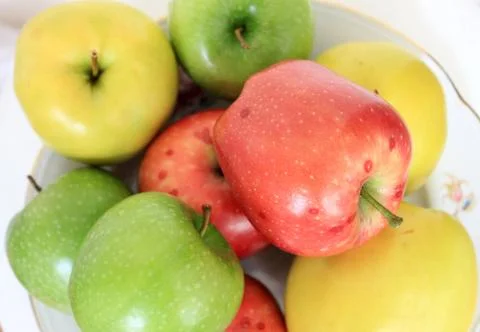 Colored apples Stock Photos