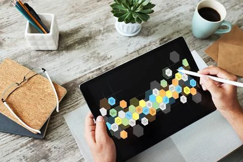 Colored APPS icons on tablet screen. Personal application and software Stock Photos