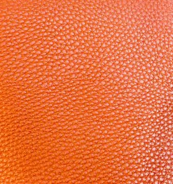 Colored artificial leather texture orange 스톡 사진