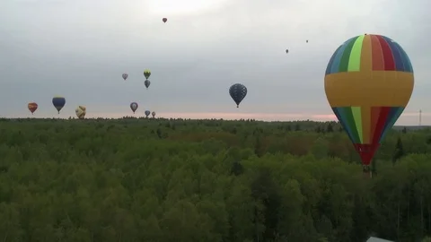 Colored balloon flying over forest aerial short Video stock 78052265