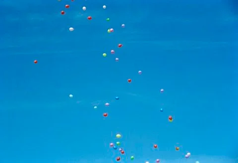 Colored balloons floating in the sky Foto stock