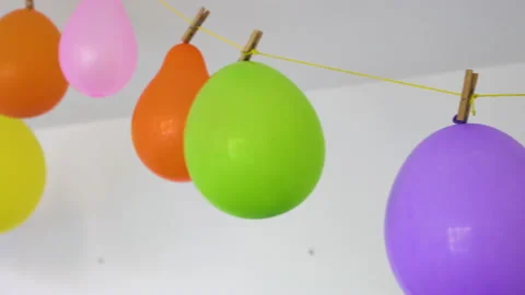 Colored balloons hung for the celebration of Vidéo 220510919