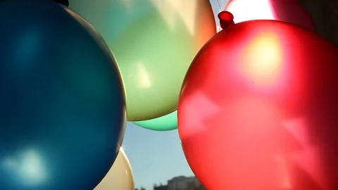 Colored balloons moves with sunshine 動画素材 70399084
