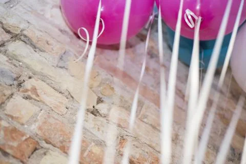 Colored balloons on a wooden table. Stock Photos