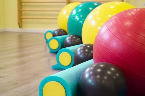 Colored balls and rollers for pilates classes Stock Photos
