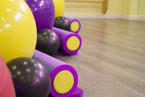 Colored balls and rollers for pilates classes Stock Photos