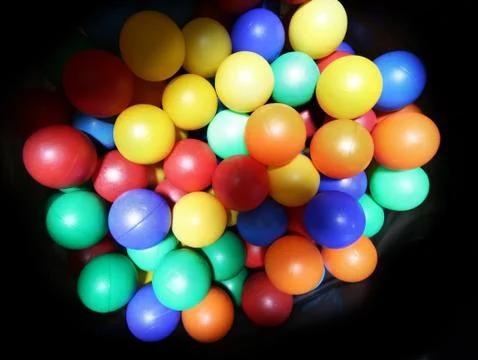 Colored balls inside the big bag black Stock-Fotos
