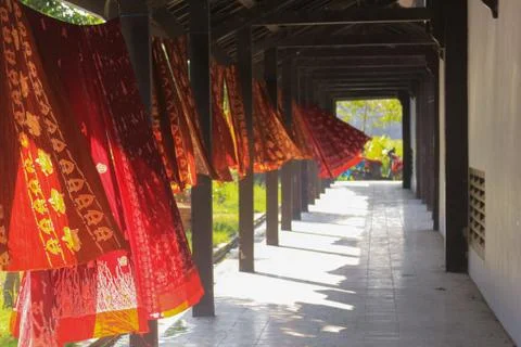 Colored Batik textile hanging in the wind Lombok Stock Photos