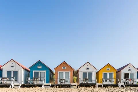 Colored beach houses in a row Stock Photos