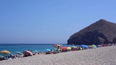 Colored beach umbrellas on windy Playa de los Muertos beach Видео 280741740