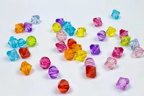 Colored beads for design on a white background Stock Photos