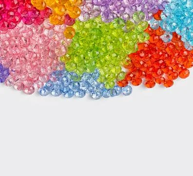 Colored beads for design on a white background Stock Photos
